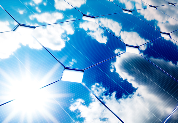 Solar energy concept. Blue sky reflection on photovoltaic panel.