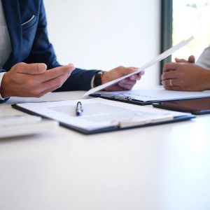 A document on a table with a pen